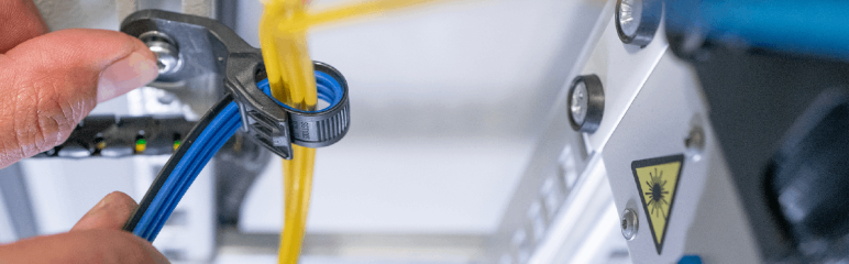 HellermannTyton About us introduction banner image showing SoftGrip cable tie fastening sensitive glass fibre cables