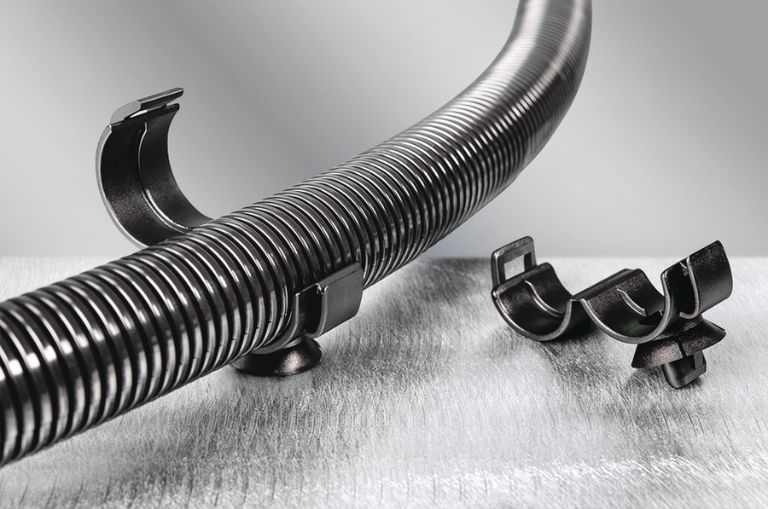 Convoluted corrugated tube clamp for fluid routing in vehicles