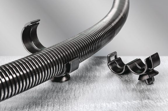 Convoluted corrugated tube clamp for fluid routing in vehicles