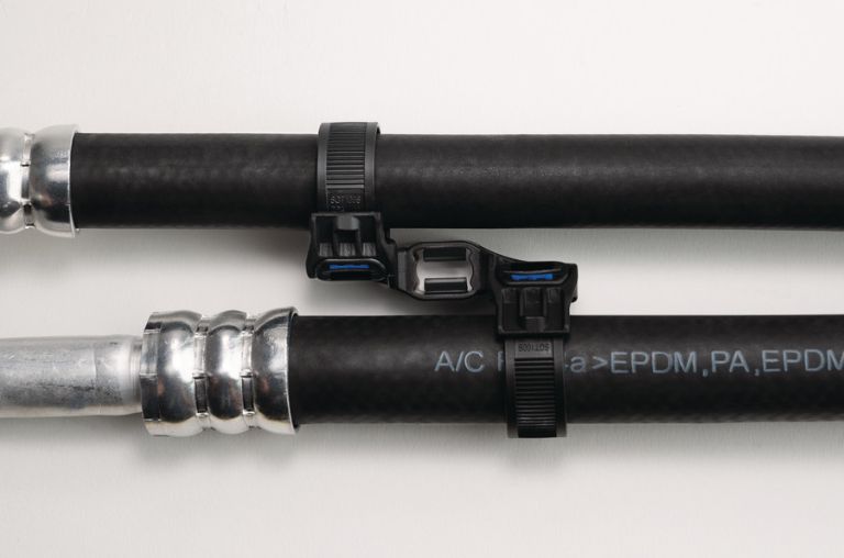 HVAC lines held in parallel by a Soft Grip mount and tie