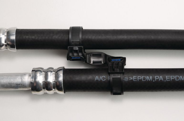HVAC lines held in parallel by a Soft Grip mount and tie
