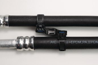 HVAC lines held in parallel by a Soft Grip mount and tie