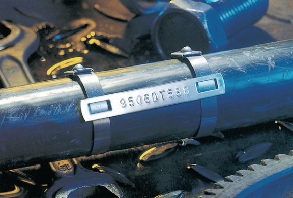 Industrial identification for pre-embossed markers and stainless steel ties