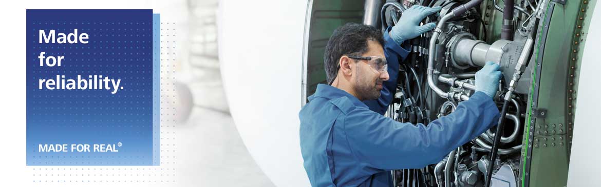 men working on jet engine