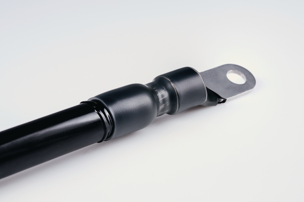 Semi-rigid halogen free polyolefin heat shrink tubing with an inner liner of hot melt adhesive.
