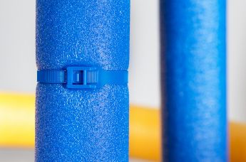 Not only because of their variety of colours, cable ties with low profile head are often used on children's playgrounds.