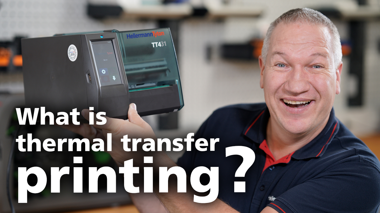 Man holds a thermal transfer printer TT431 in his hands