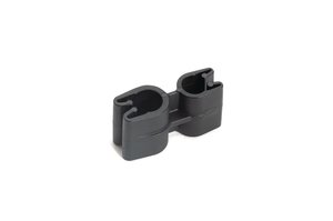 Dual pipe clip secures two routings together while keeping them separated, to prevent chafing or heat transfer.