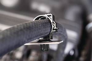 Locking tab on this clip is small enough that it will not interfere with any other portion of the wire routing, but is significant enough to allow for manual disengagement if service is needed.