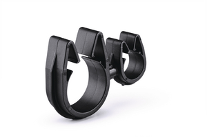 A rotatable dual routing clip that keeps two routings secured and separated.