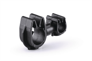 A rotatable dual routing clip that keeps two routings secured and separated.