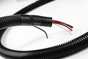 Tubing protects cables and wires against automotive fluids, vibration wear.