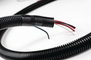 Tubing protects cables and wires against automotive fluids, vibration wear.