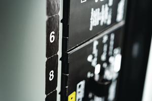 Phase labels are microperforated for application as one strip to the panel or broken into individual labels.