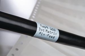 A self laminating transparent vinyl material with acrylic adhesive. Write on area is white.