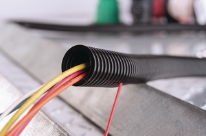 With a split down the side where you can insert your wire harness, you can just easily install Convoluted Tubing without removal of the entire assembly.