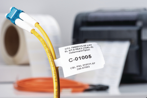 Thermal transfer label leaves no exposed adhesive, so it won't adhere to adjacent labels.