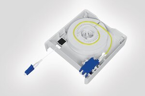 Internal view of the Faint Fibre Outlet with fibre spool, LC DX adaptor and connector.