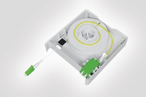 Internal view of the Faint Fibre Outlet with fibre spool, LC DX adaptor and connector.