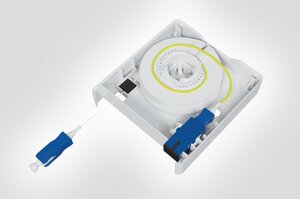 Internal view of the Faint Fibre Outlet with fibre spool, SC SX adaptor and connector.