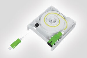 Internal view of the Faint Fibre Outlet with fibre spool, SC SX adaptor and connector.