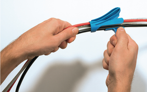 Insert one or more cables into the insertion slot of the applicator tool.