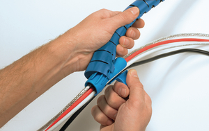 Place the applicator tool in one end of the Helawrap cable cover.