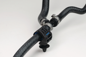 Soft Grip Cable Tie assembled with Soft Grip Mount for holes (arrowhead) and hoses for fluid management.