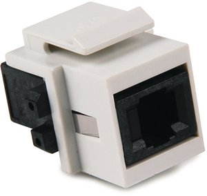 The connector module is a keystone footprint that inserts into HellermannTyton's standard flush wall plates.