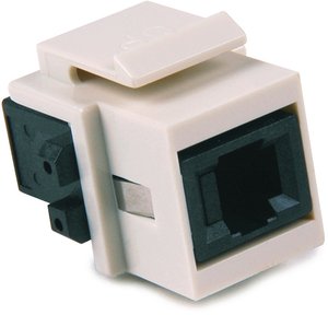 The connector module is a keystone footprint that inserts into HellermannTyton's standard flush wall plates.