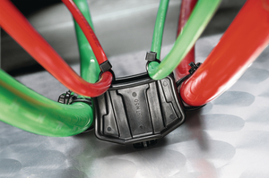 The mount can secure up to four separate bundles, providing parallel spacing between the frame rail and adjacent bundles.