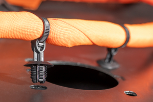 This fixing tie features an oval hole with firtree and an integrated spacer that lifts the harness away from the panel surface, improving abrasion protection and ensuring clean, secure cable routing.