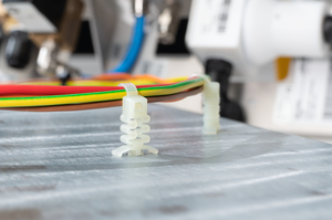 Vibration damping article for round holes with expansion anchor, which cushions strong vibrations with impact on cables and surrounding elements.