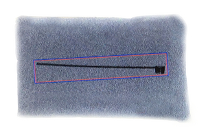 X-ray detected cable tie in a rice package, which can also be detected in sections.