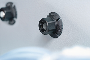 Plastic Nuts simply pushed onto bolt by hand.