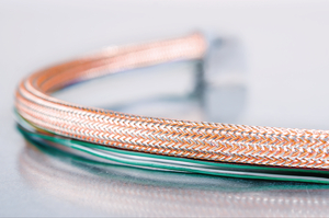 HEGEMIP-HY braided sleeving: EMI protection for hybrid automobiles.