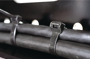Heavy duty cable tie features a release in the head for easier bundle maintenance.