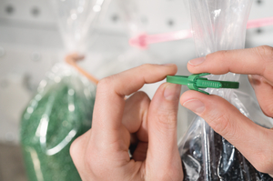 REZ cable ties with quick-release mechanism for one-hand operation. Perfect for use in the packaging industry as a bag closure.