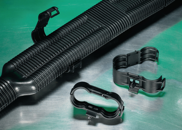 Simple and secure installation of pipes or hoses to panels.